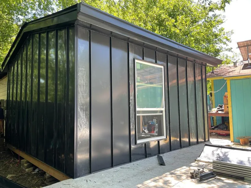 Black standing seam metal wall panels for Roof Inspection in Glendale